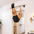 Wooden pull-up bar for wall mounting above door frame